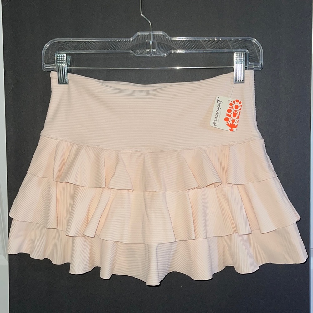 Free People tennis skirt. Blush color. Brand new. Size small. No pets/ no smoke.